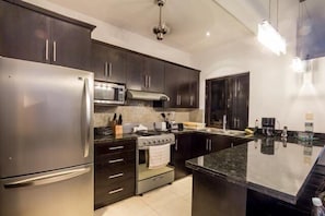 Fridge, coffee/tea maker, toaster, cookware/dishes/utensils