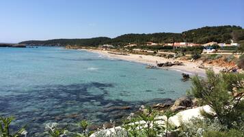 On the beach, sun loungers, beach towels