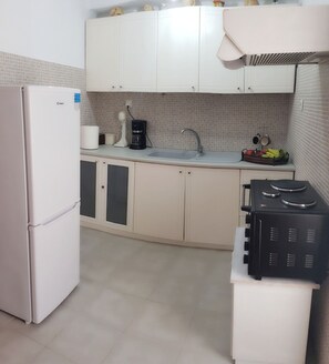 Fridge, coffee/tea maker, toaster, cookware/dishes/utensils