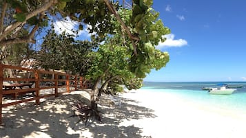 On the beach, sun-loungers, beach towels