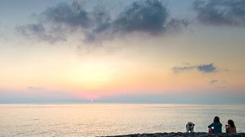 On the beach, sun loungers, beach towels