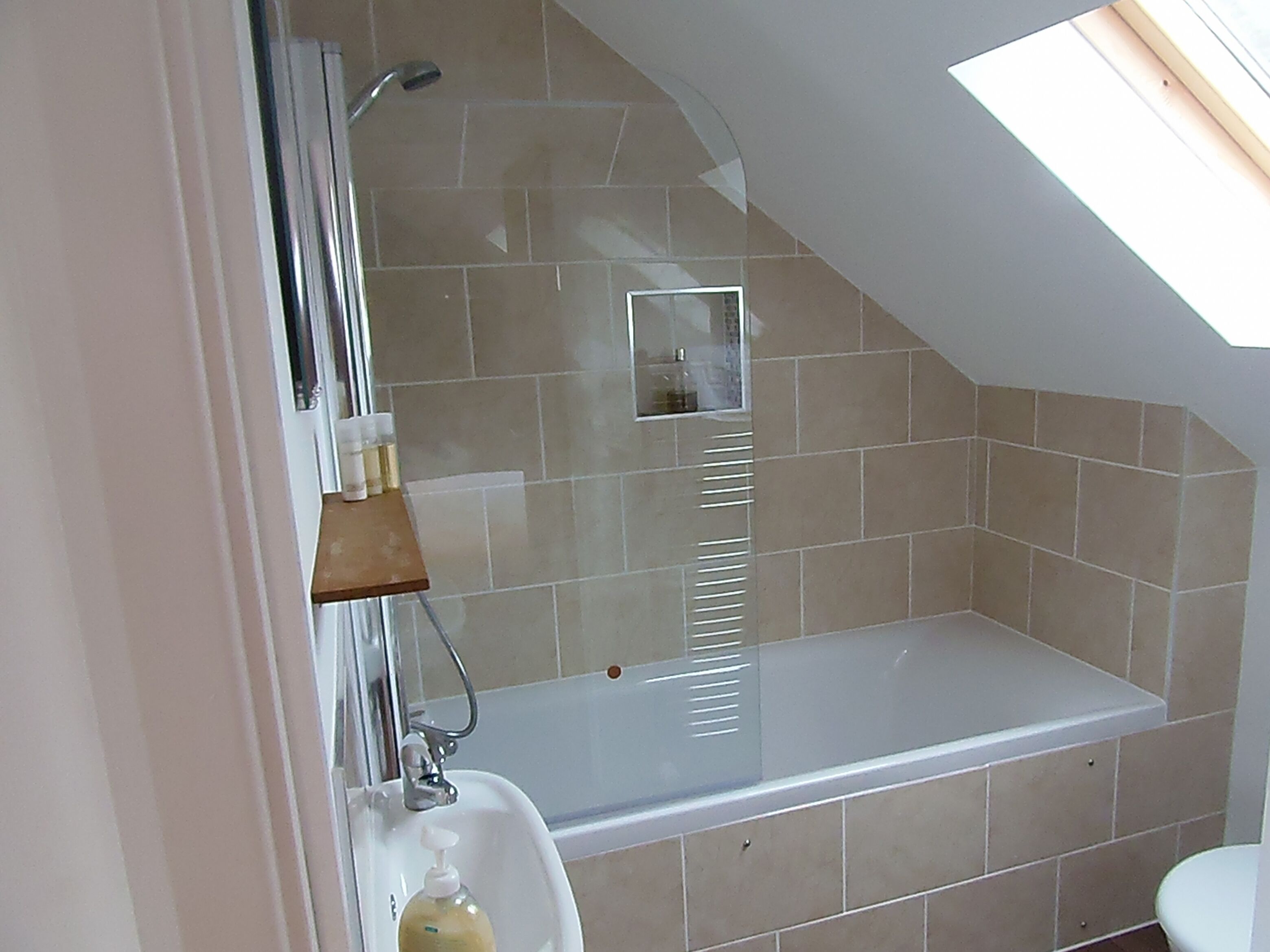 Bathtub, hair dryer, towels