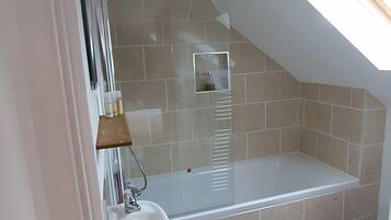 Bathtub, hair dryer, towels