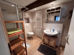 Bathtub, hair dryer, towels, soap