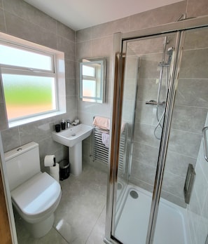 Shower, hair dryer, towels, soap