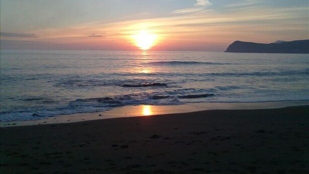 A beach with a sunset over the ocean. - Spectacular Views, Miles of Beaches, and Boat Trips, 4 Star  Luxury Home (Dingle)