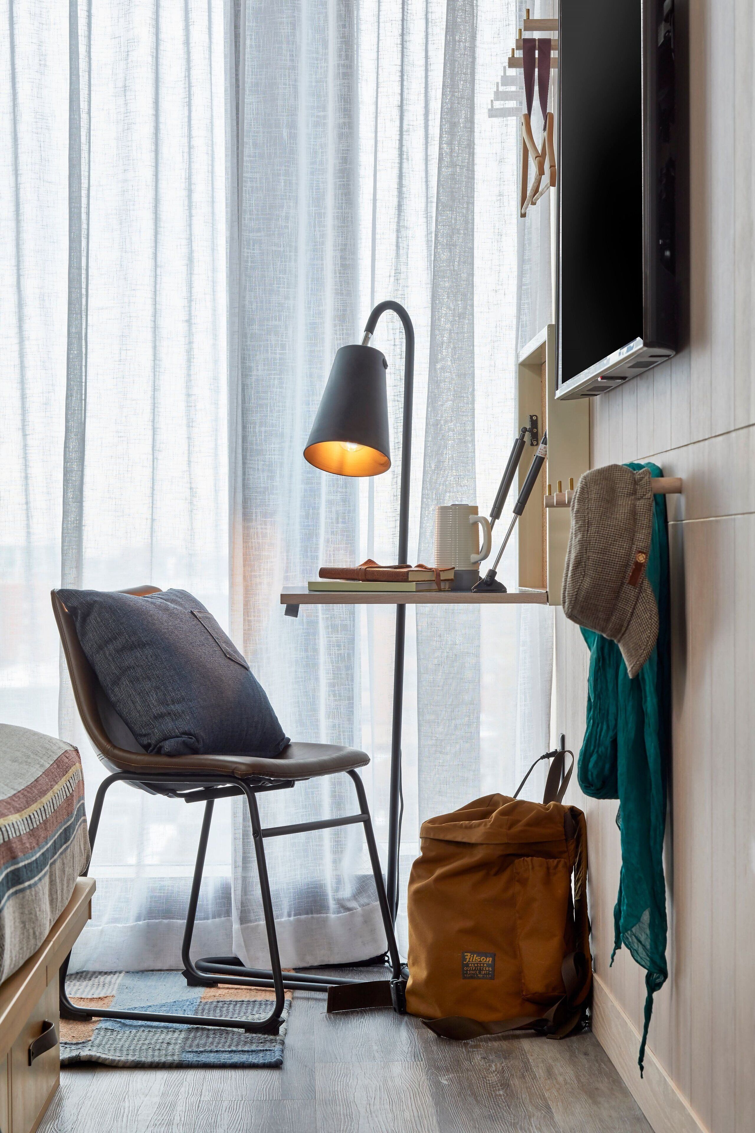 pillow-top beds, desk, laptop workspace, blackout curtains