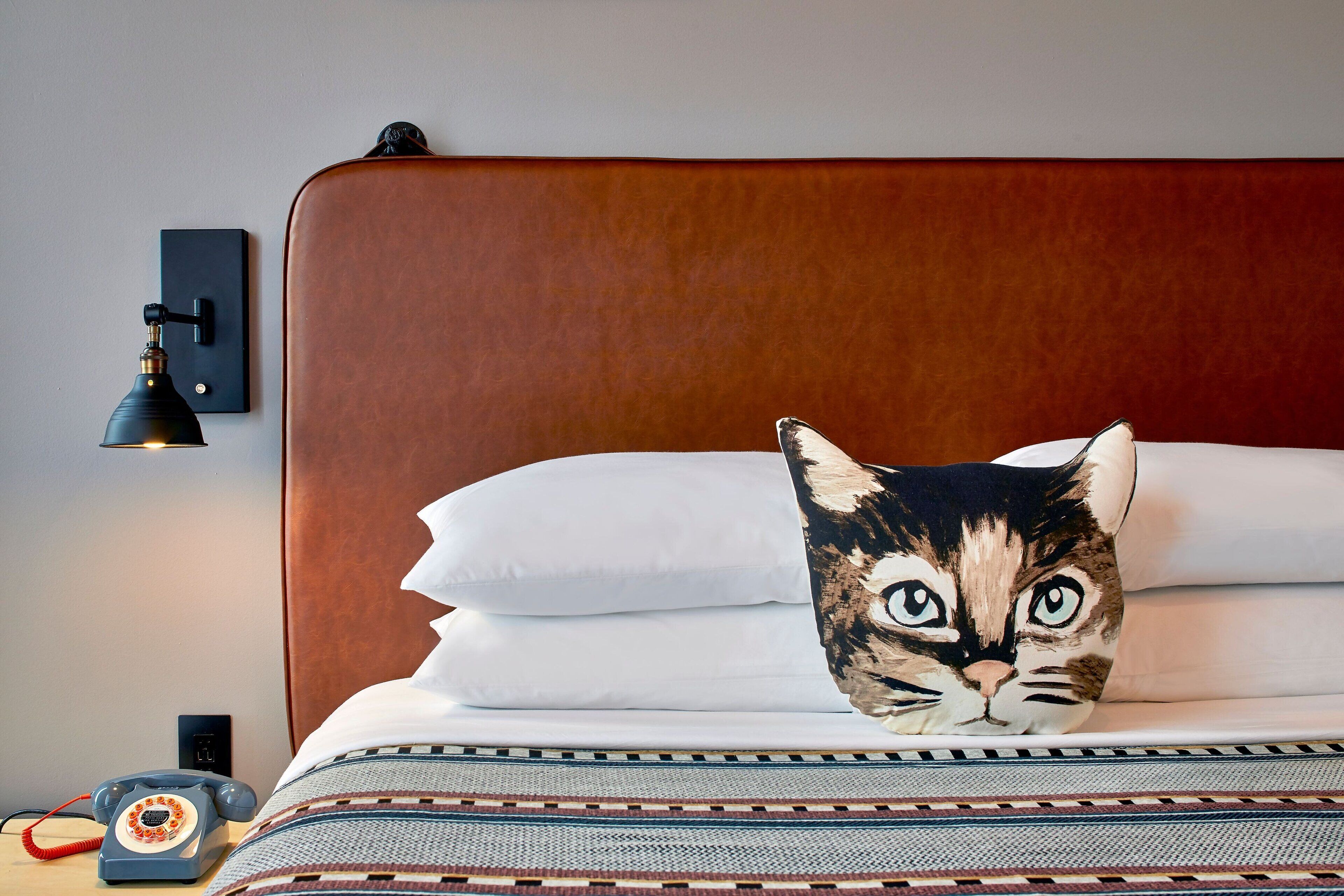 pillow-top beds, desk, laptop workspace, blackout curtains