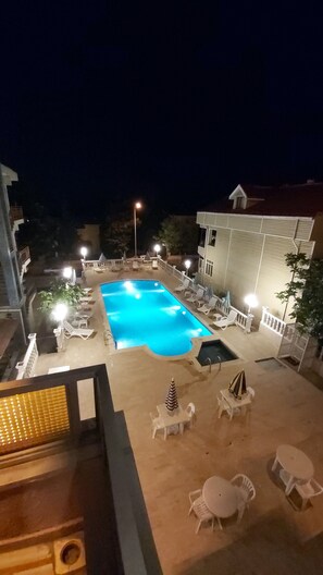 Seasonal outdoor pool, pool umbrellas, pool loungers