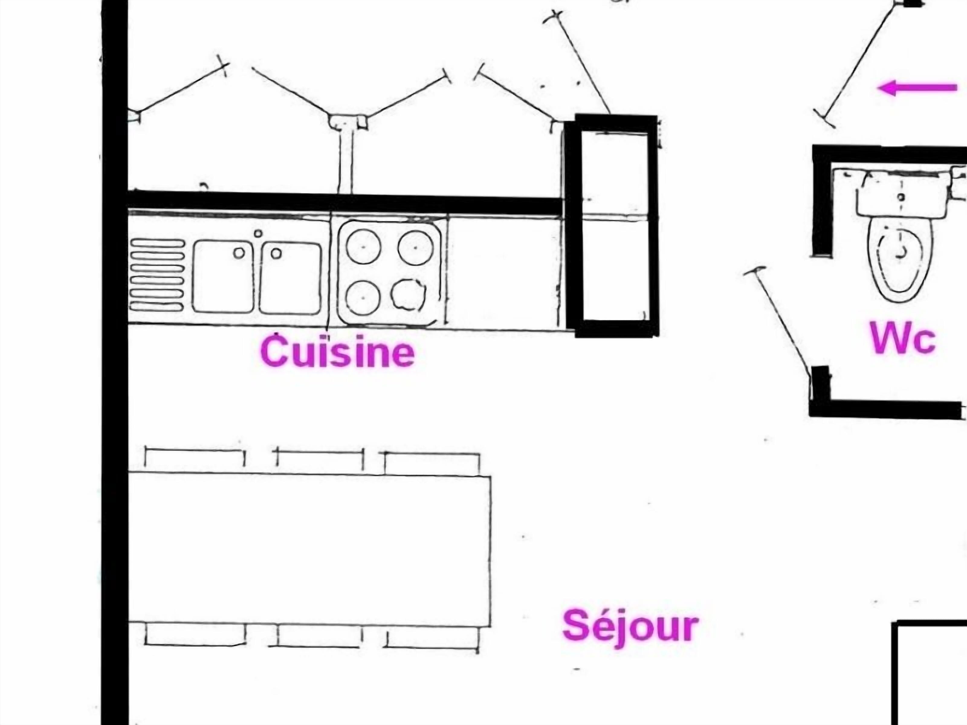 A floor plan with a kitchen labeled 'Cuisine' and a bathroom labeled 'WC'.