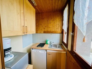 Fridge, microwave, stovetop, coffee/tea maker