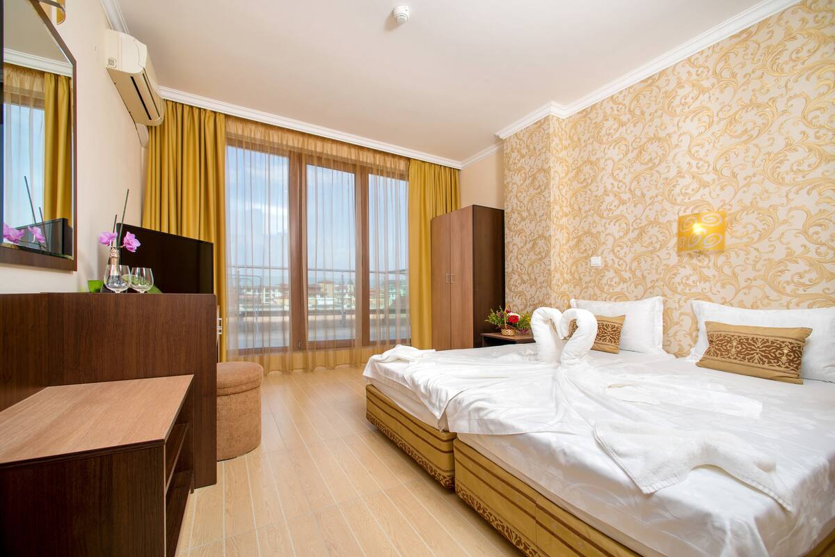 Suite, 1 Bedroom, Balcony (4 Adults) | 1 bedroom, iron/ironing board, free cribs/infant beds, free WiFi