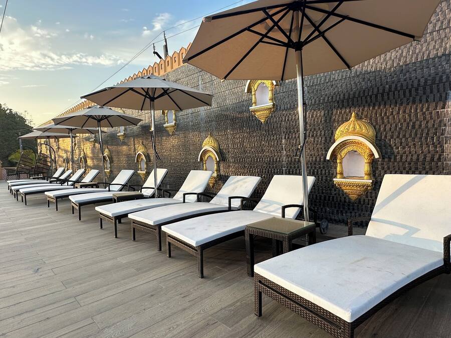 Outdoor pool, a natural pool, open 8:00 AM to 6:00 PM, pool umbrellas