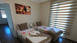 A hotel room with two beds, a painting of a sunset, and a window with blinds. - NEW LISTING!! BEAUTIFUL PRIVATE 5 BEDROOM VILLA RIGHT in CENTRE of DALYAN!!! (Dalyan Mahallesi / Ortaca)