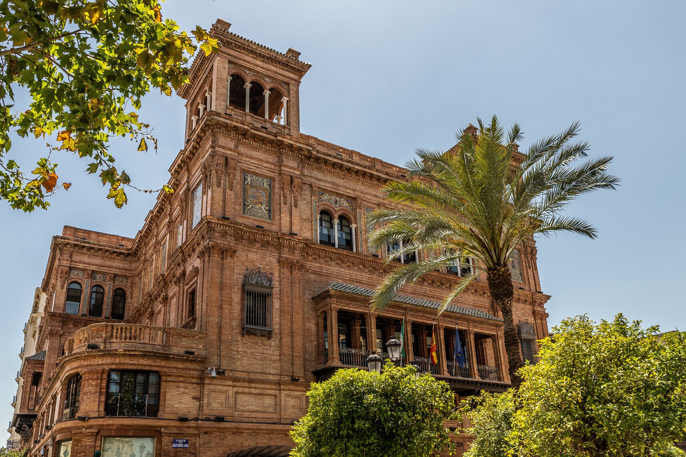A historic building with ornate architecture, including a prominent tower and detailed facade.