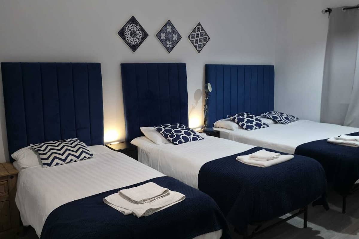 Comfort Quadruple Room | 1 bedroom, desk, blackout curtains, iron/ironing board