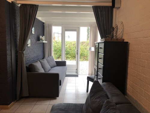 Cottage coast in South Holland behind the dunes by the sea