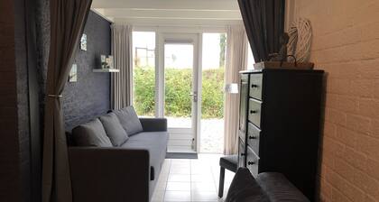 Cottage coast in South Holland behind the dunes by the sea