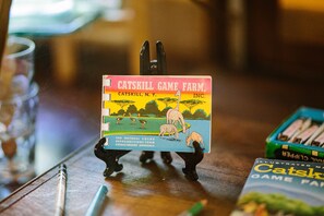 A game box titled 'Catskill Game Farm' with illustrations of animals and a scenic background.