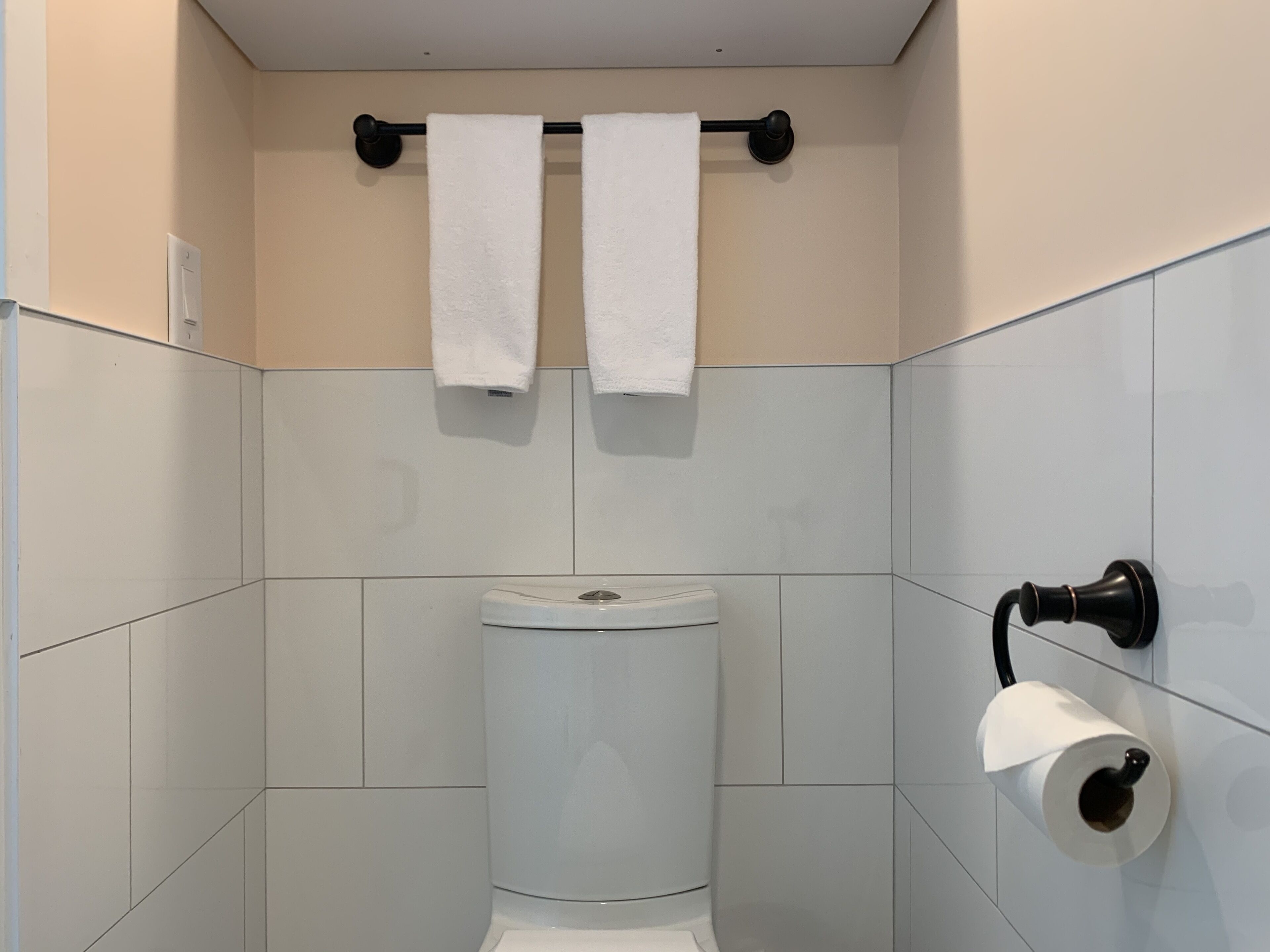 standard room (queen quarters with twin loft) | bathroom | shower, rainfall showerhead, hair dryer, towels