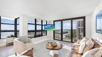 Condo, Multiple Beds (Beachfront condo with panoramic ocean) | Living area | Flat-screen TV