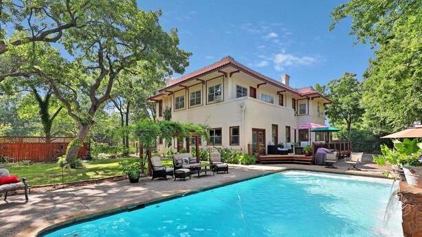 A two-story house with a swimming pool, outdoor furniture, and a well-maintained garden. - The Lancaster Manor B&B (Gainesville)