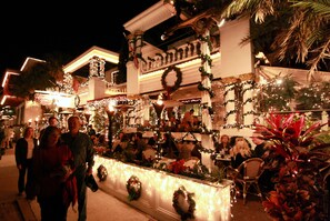 A restaurant with outdoor seating, decorated with Christmas lights and wreaths. - Casablanca Inn on the Bay (St. Augustine)