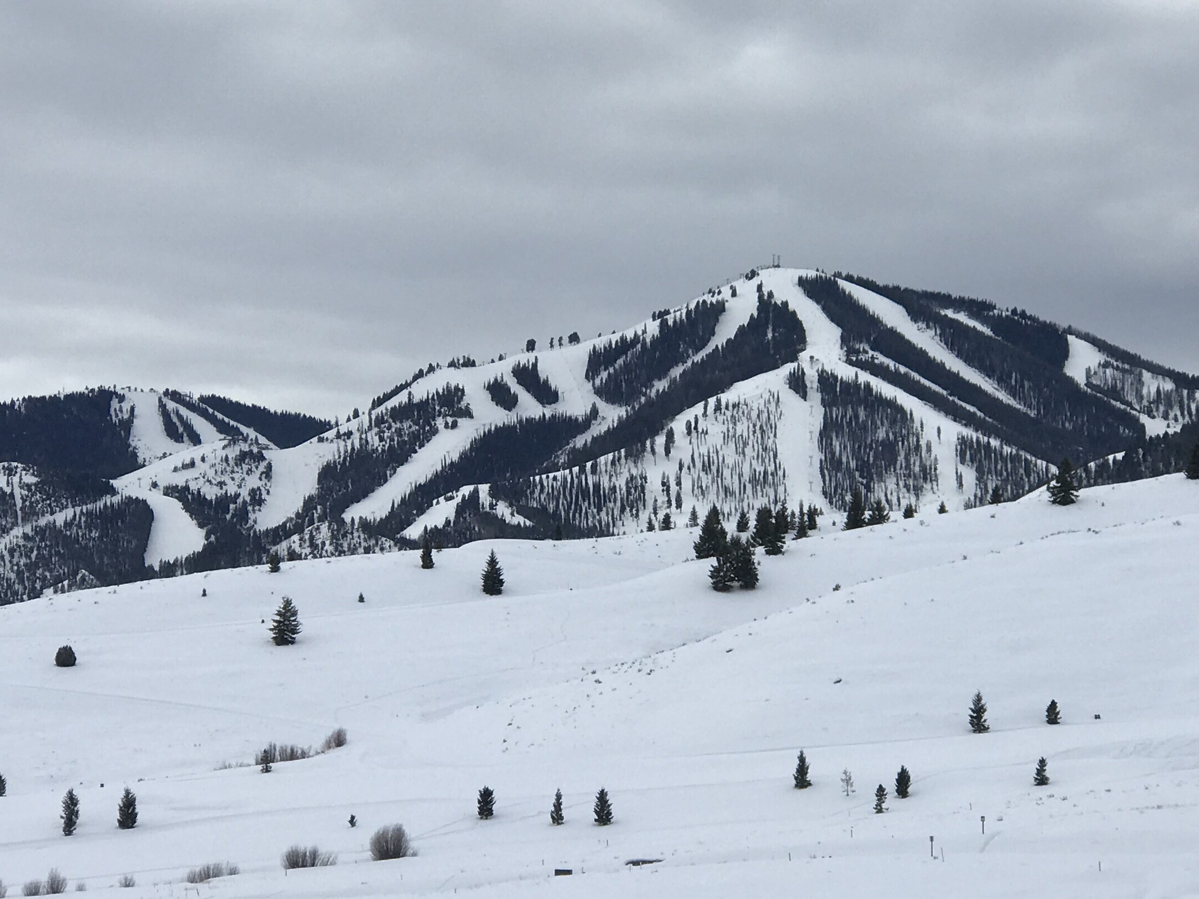 A snow-covered mountain landscape with a clear sky.