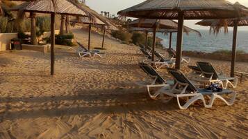 Sun-loungers, beach towels