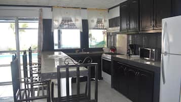 Fridge, microwave, cleaning supplies