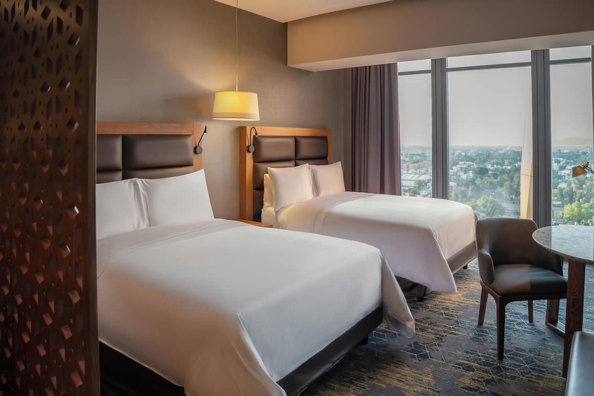 Premium bedding, down comforters, pillowtop beds, minibar