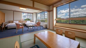 A hotel room with a large window, a bed, a desk, and a chair. - Chikugofunagoya Kouennoyado (Chikugo)