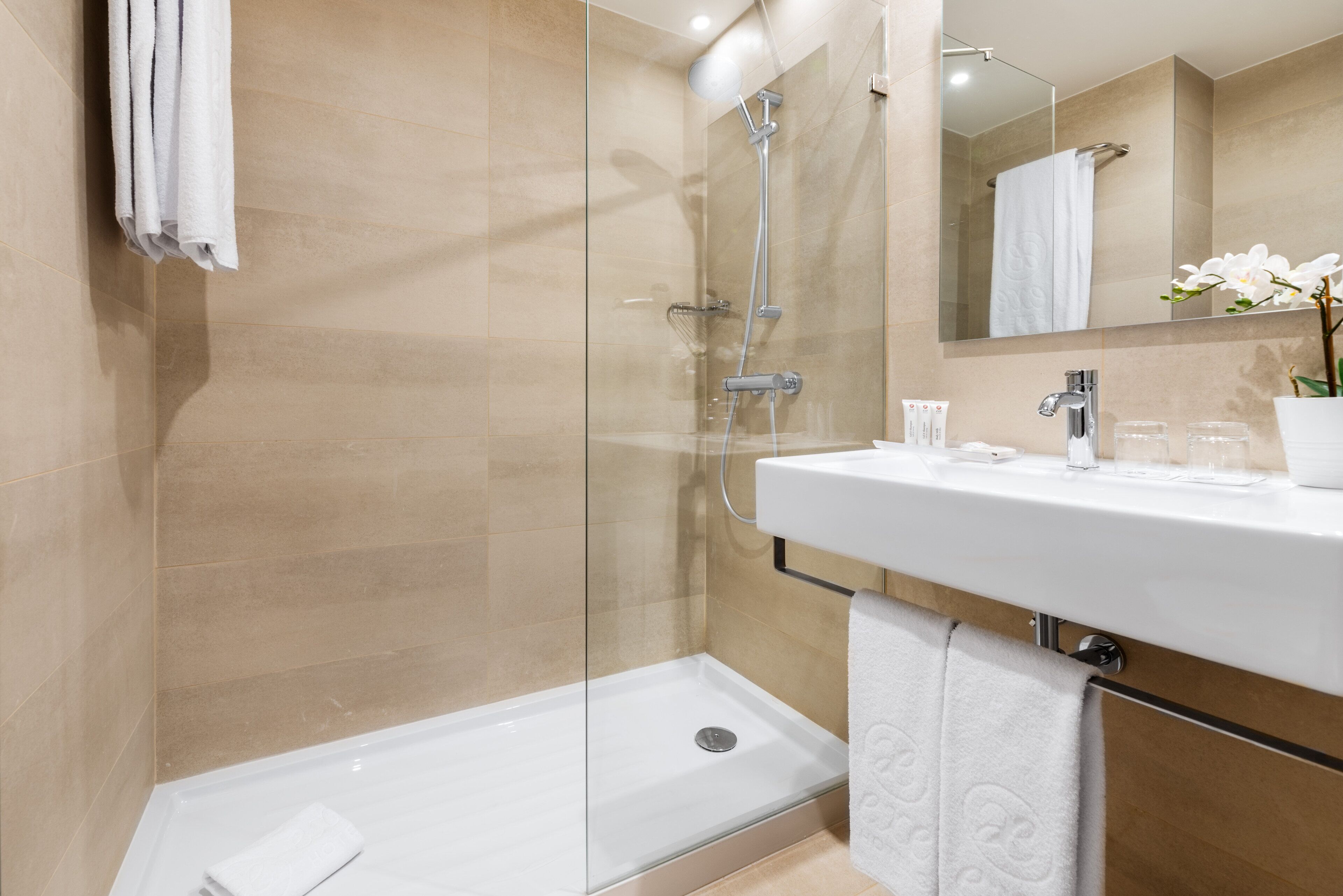 eco-friendly toiletries, hair dryer, towels