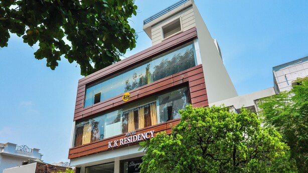 A modern hotel with a two-story facade, large glass windows, and a visible sign for 'K.K. Residency'. - Itsy Hotels K K Residency Staywell (Roorkee)