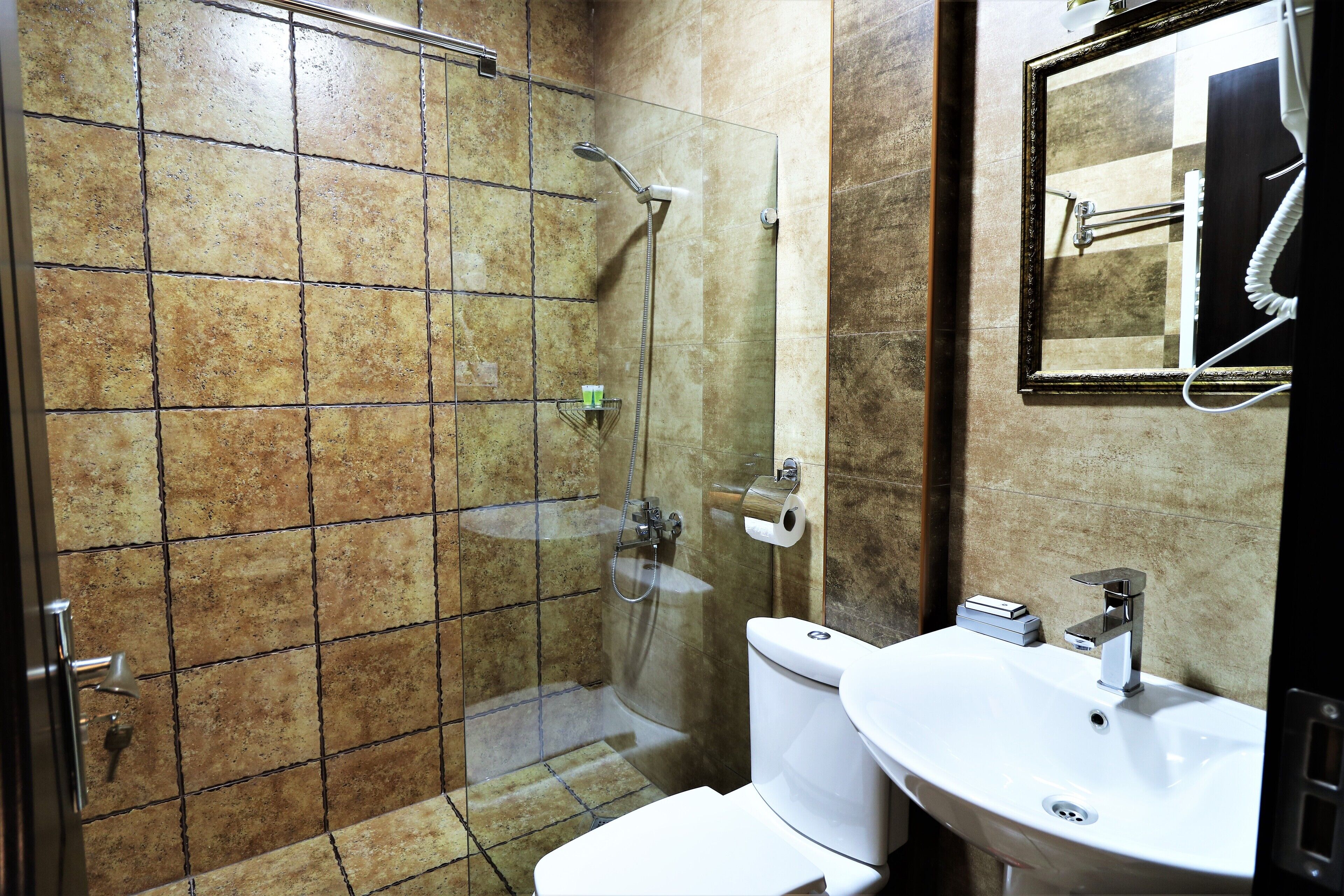superior room | bathroom | shower, rainfall showerhead, free toiletries, hair dryer