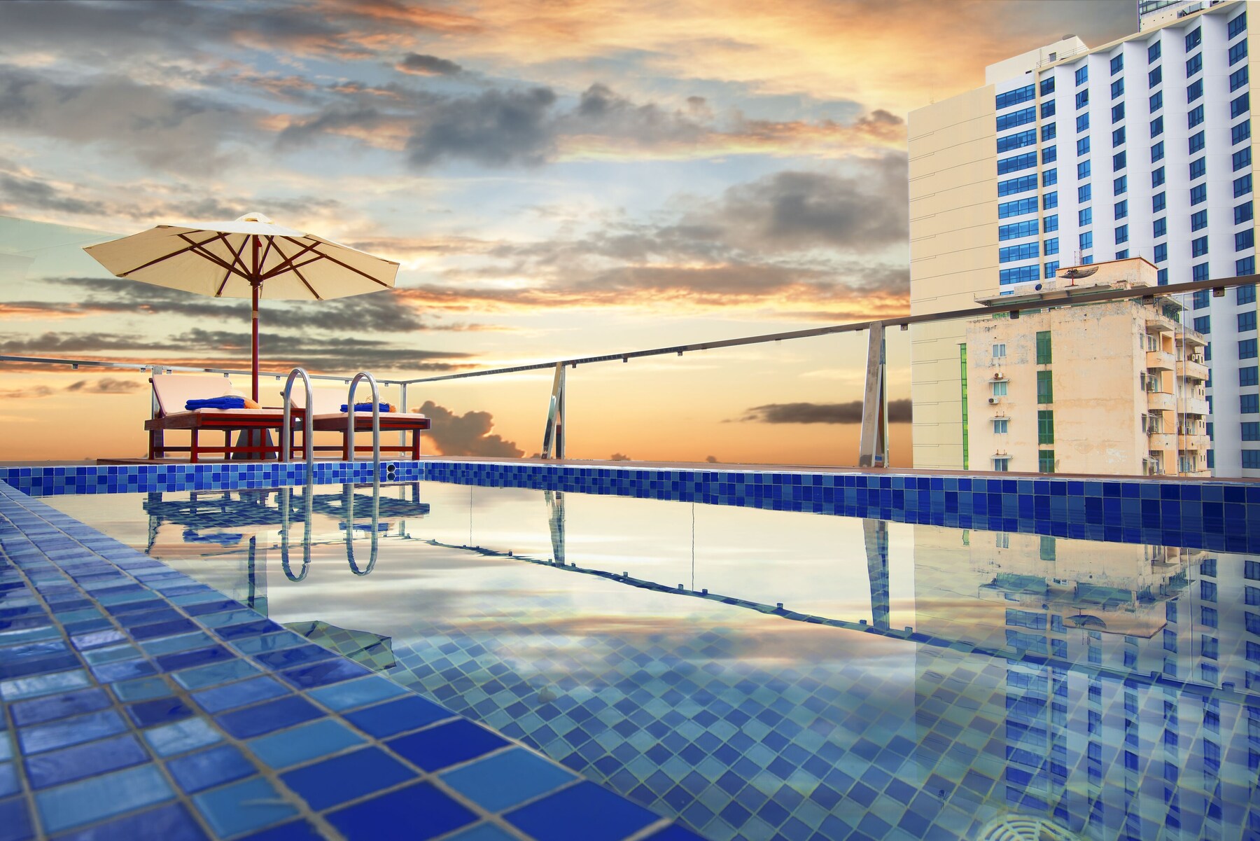 Outdoor pool, open 5:00 AM to 6:00 PM, pool umbrellas, pool loungers