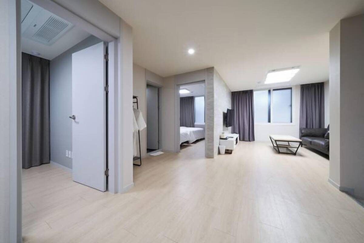 Premium bedding, desk, laptop workspace, blackout drapes