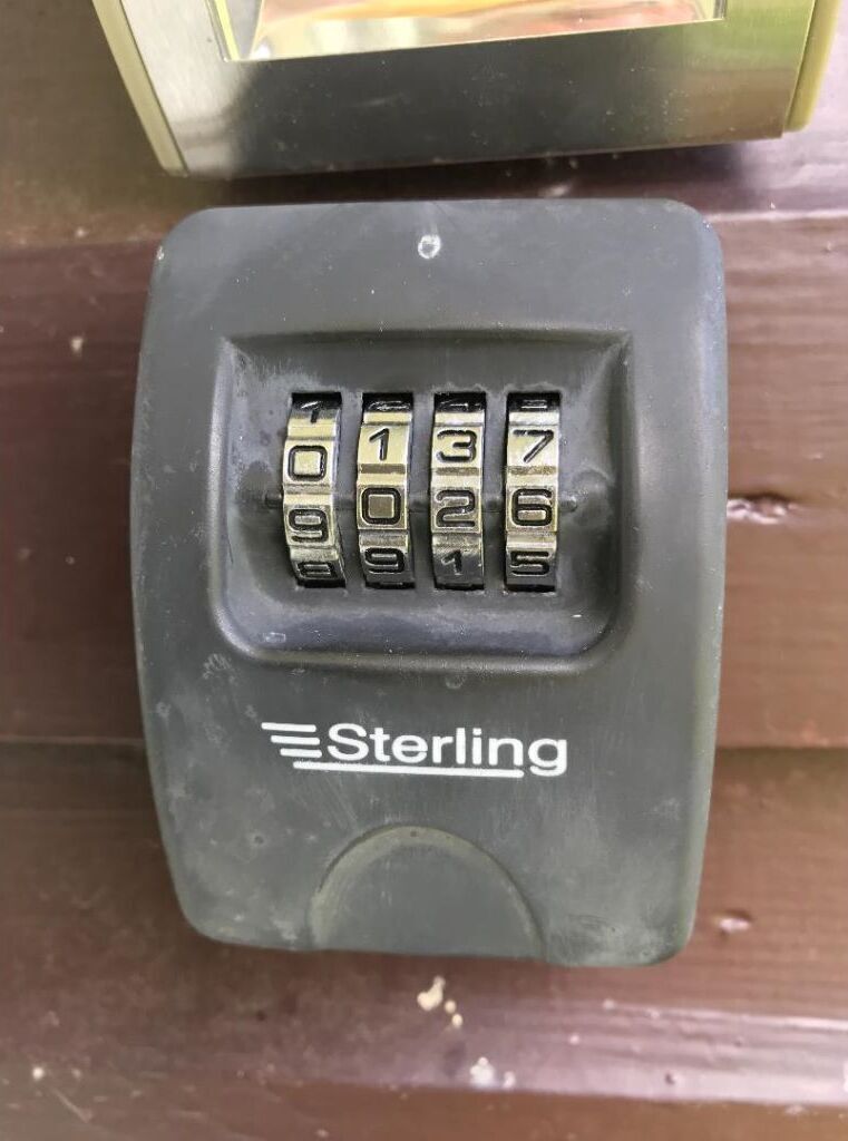 A Sterling combination lock on a black device, likely a safe or secure box.