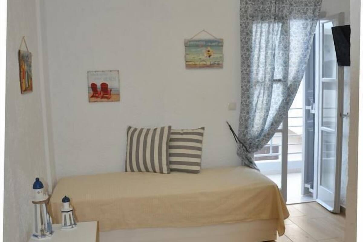 Deluxe Triple Room, Sea View | Living area | Flat-screen TV