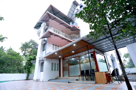 Front of property – evening/night. Base9 Airport Hotel