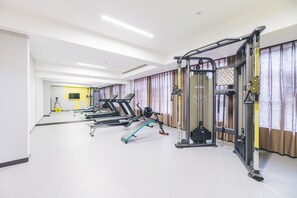 A gym with treadmills, weight machines, and a pull-up bar. - Atour Hotel Xiangshui Bay Hainan (Lingshui)