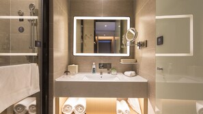 A modern bathroom with a large mirror, a sink, and a glass-enclosed shower. - Atour Hotel Jiuyan Bridge NetEase Strict Selection Chengdu (Chengdu)