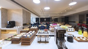 A buffet setup with various food items and a coffee machine. - Atour Hotel Jiuyan Bridge NetEase Strict Selection Chengdu (Chengdu)