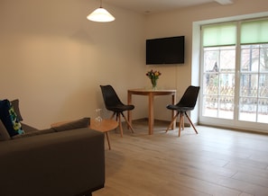 Apartment | Living area | Flat-screen TV - Ferienwohnung Remise (Lübbenau/Spreewald)