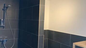 Shower, rainfall showerhead, hair dryer, towels