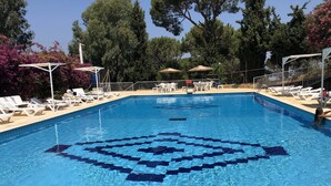 A clear blue swimming pool with a geometric pattern in the center, surrounded by white lounge chairs and umbrellas. - Splendid Valley & Sea View (Broumana)