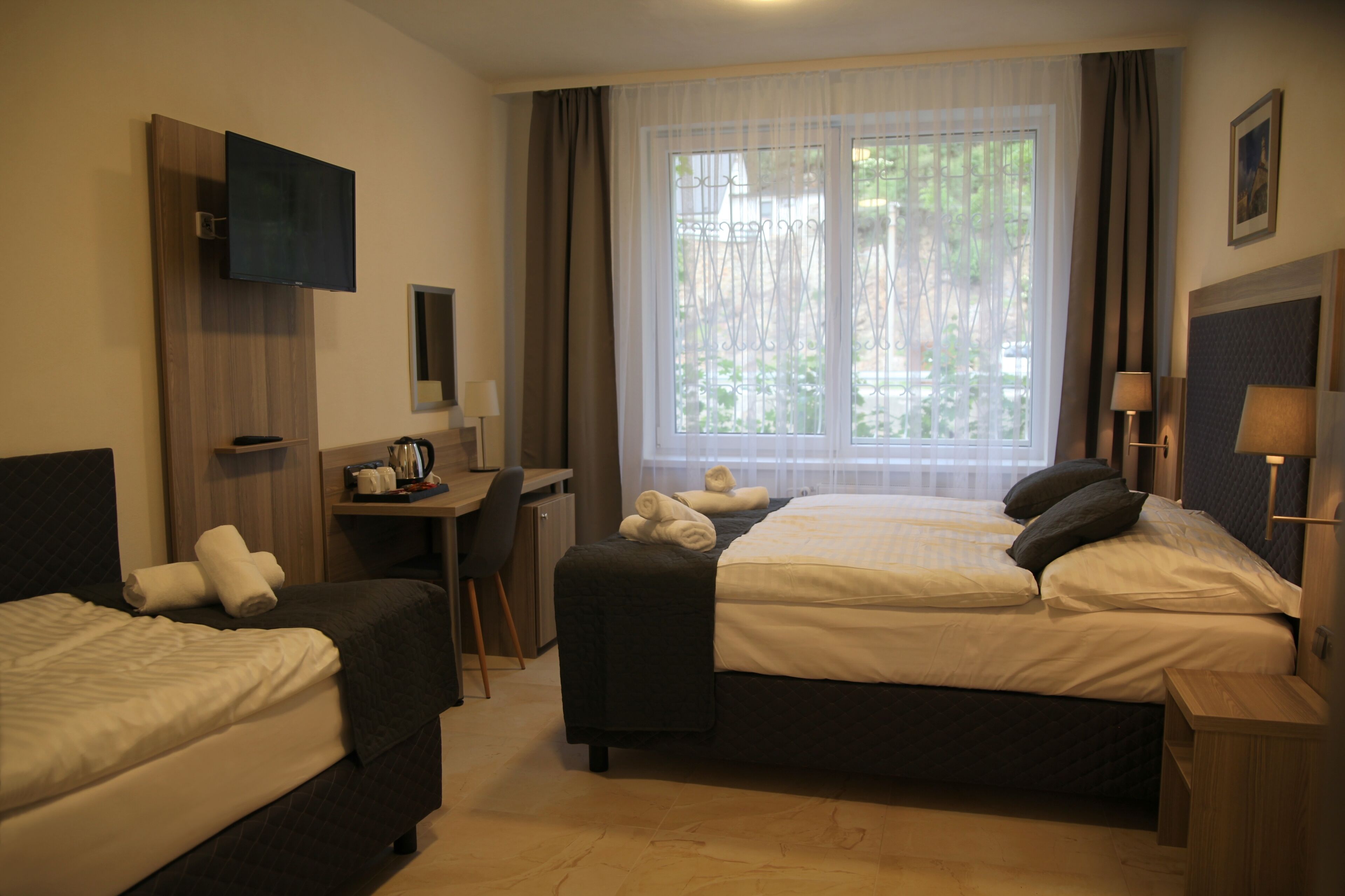 family room | desk, laptop workspace, blackout curtains, free wifi