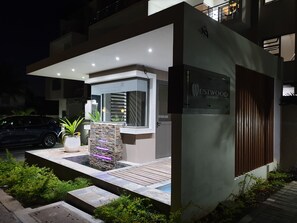 Welcome to Westwood Apartments, where a serene entrance sets the tone for a peaceful stay.