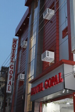 A hotel building with a sign reading 'HOTEL GOPAL' and multiple air conditioning units installed on the exterior. - Hotel Gopal (Haridwar)