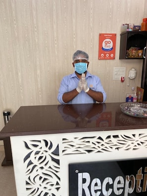A hotel reception desk with a sign that reads 'Reception'. - Hotel Gopal (Haridwar)